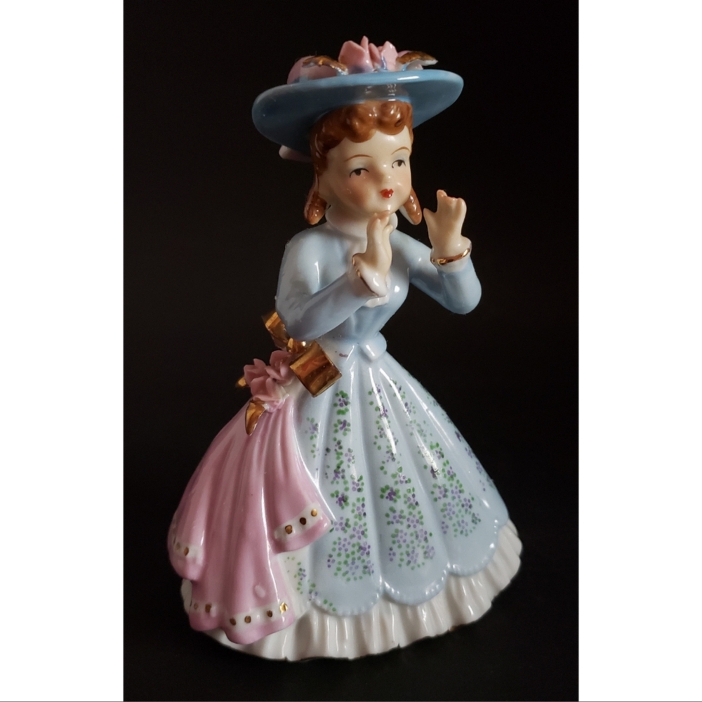 Girl Figurine in Blue Dress with Pink Bow